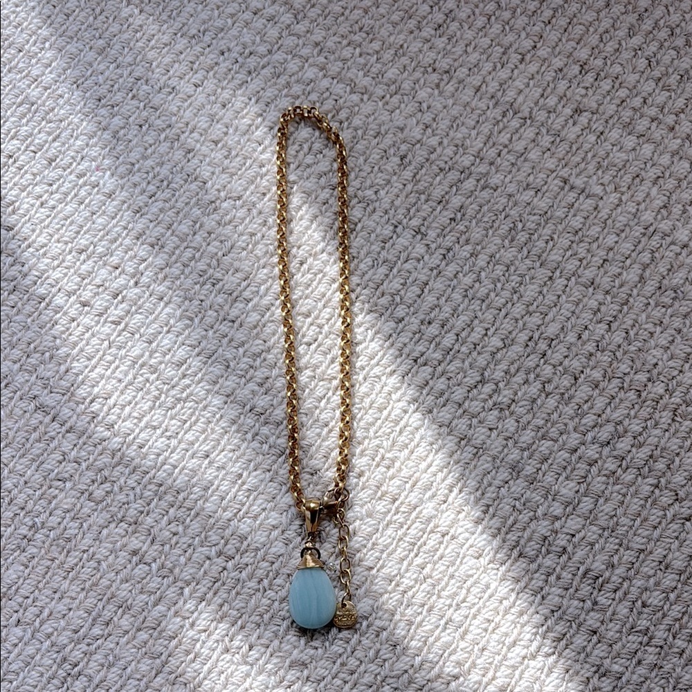 Gold and light teal pendant necklace